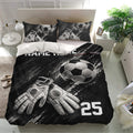 Soccer bedding set with dramatic black artwork, goalkeeper gloves, soccer balls, and matching pillowcases
