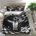 Black and white racing bedding set with helmeted driver, checkered flag pattern, and dramatic bedroom styling