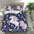 Navy unicorn bedding set with matching pillowcases, floral accents, golden stars, and rainbow artwork