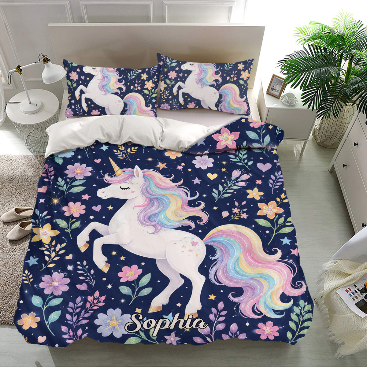 Navy unicorn bedding set with matching pillowcases, floral accents, golden stars, and rainbow artwork