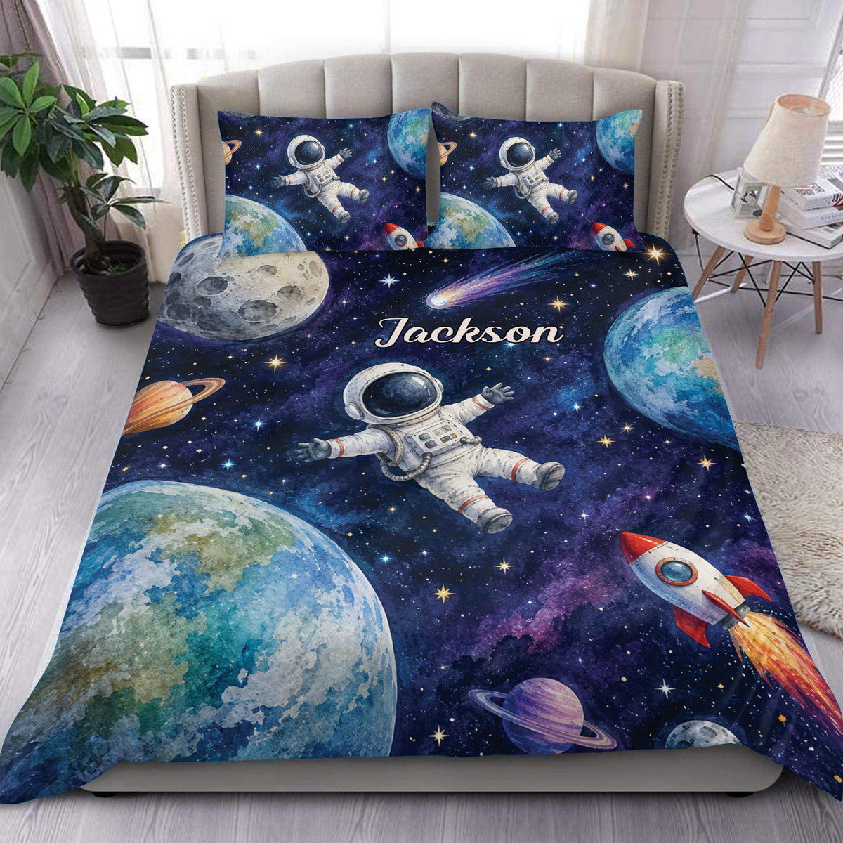 Astronaut duvet cover bedding set displayed on a bed with planets, rockets, stars, and deep-space galaxy artwork