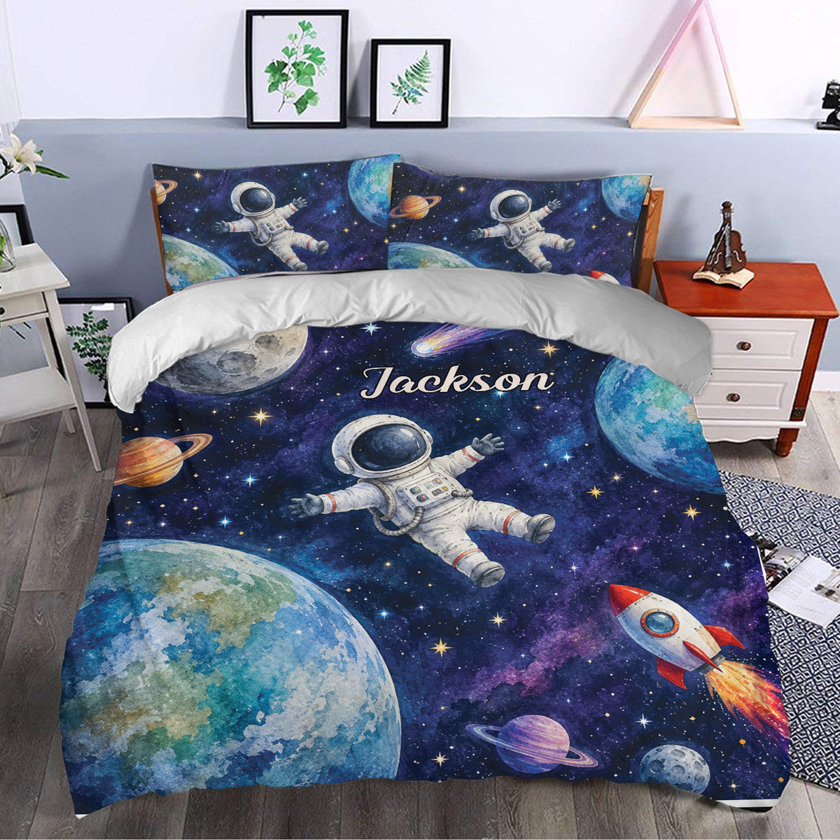 Astronaut duvet cover bedding set styled in a bedroom with galaxy artwork, planets, rockets, and astronaut scenes