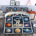 Astronaut duvet cover styling a bedroom with deep blue space artwork and colorful planets