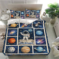 Astronaut bedding set displayed in a bright bedroom with rockets, planets, stars, and galaxies