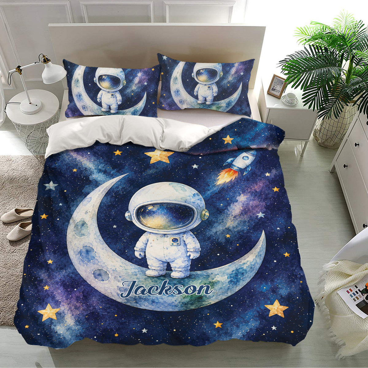 Astronaut bedding set displayed in a bright bedroom with matching moon scene pillowcases and galaxy design