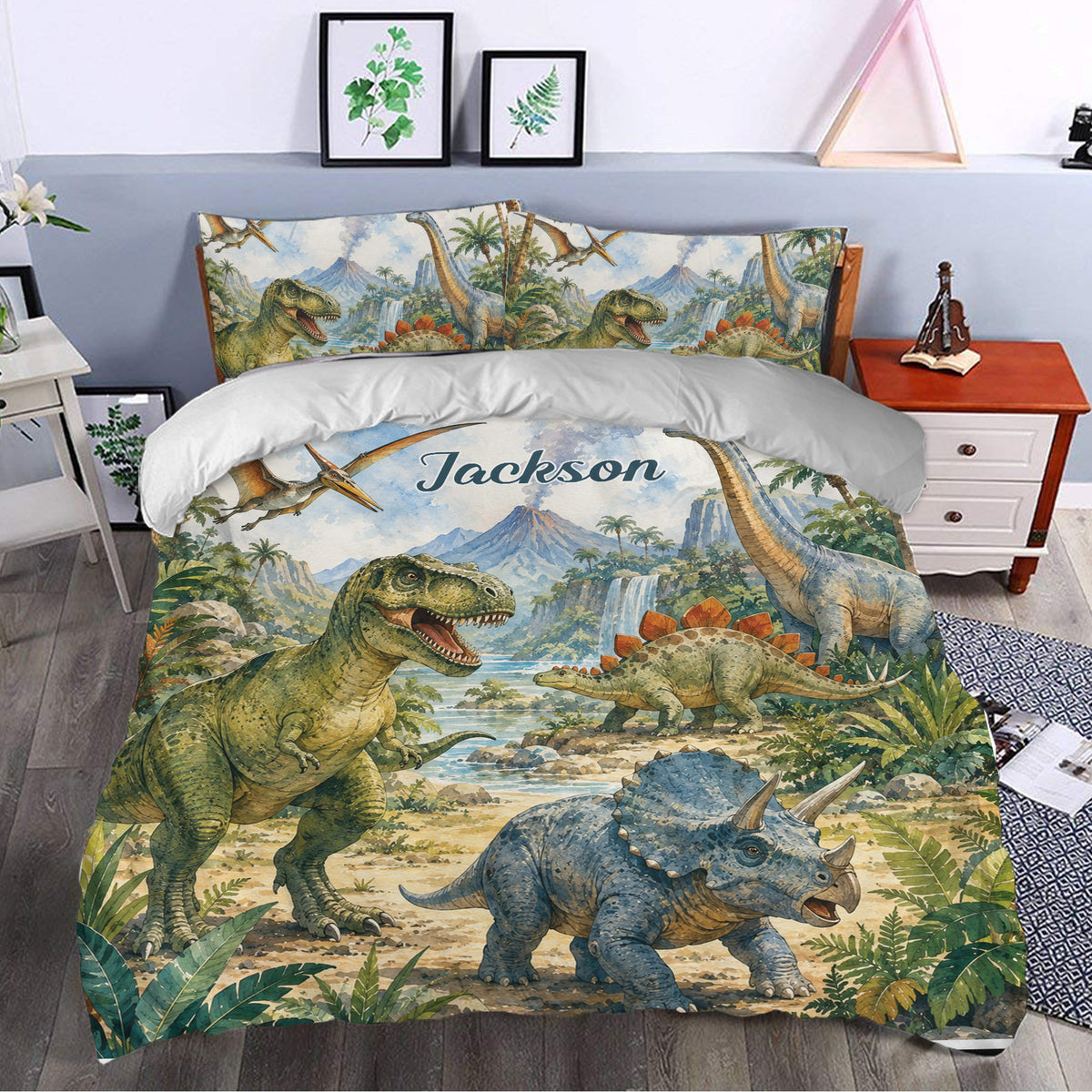 Dinosaur bedding displayed in a bedroom with jungle artwork, flying reptiles, volcanoes, and colorful prehistoric scenes