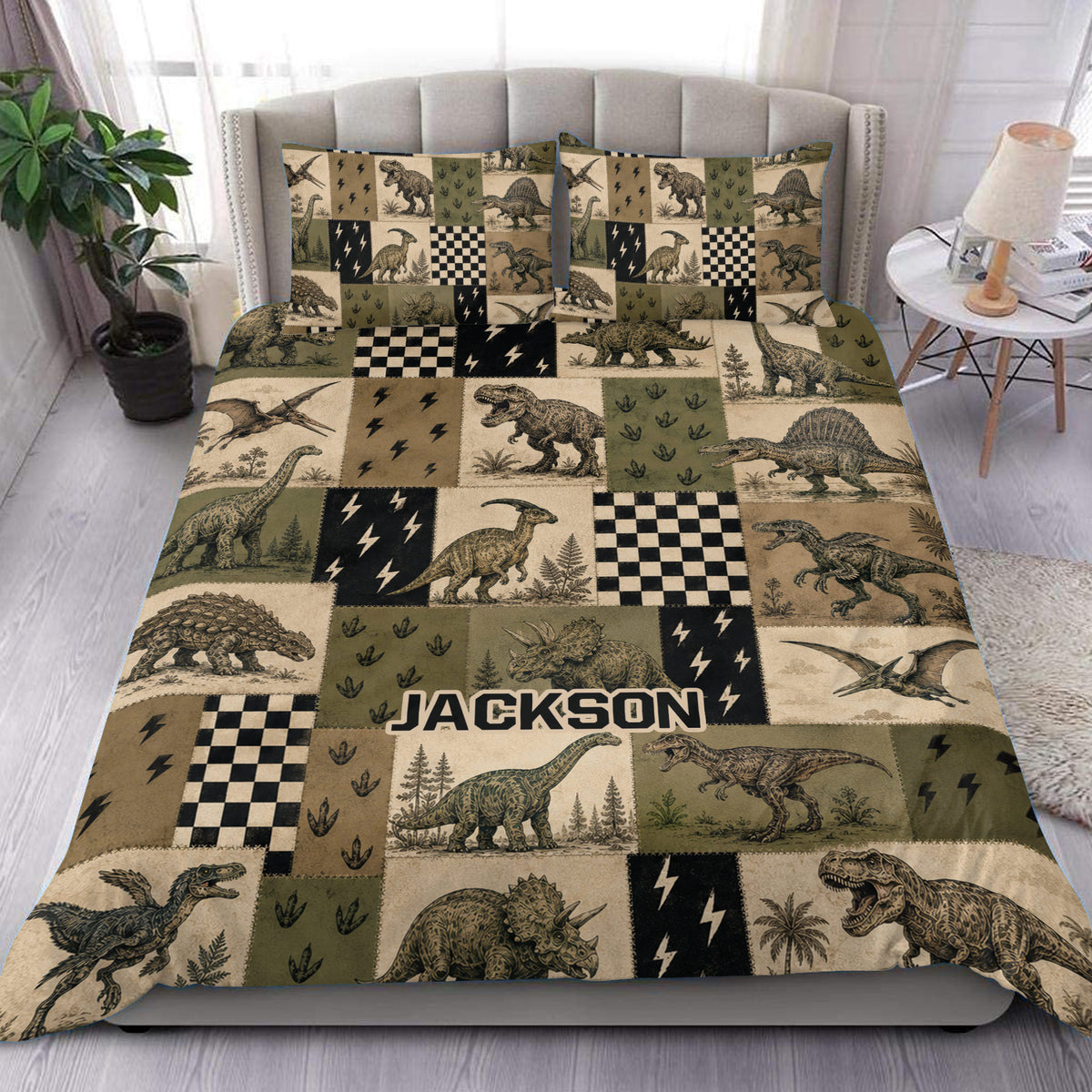 Dinosaur duvet cover bedding set displayed on a bed with vintage patchwork artwork in olive, tan, cream, and black