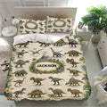 Dinosaur bedding set presented in a bright bedroom with matching pillowcases, leafy borders, and detailed prehistoric artwork