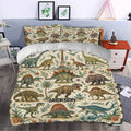 Dinosaur duvet cover styled in a bedroom with vintage dinosaur illustrations, flowers, palms, and volcano artwork