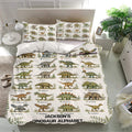 Dinosaur alphabet duvet cover set displayed in a bright bedroom with matching pillowcases and detailed artwork