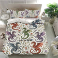 Fantasy dragon duvet cover set displayed on a modern bed with matching pillowcases and botanical details