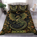 Dragon duvet cover set styled on a bed with green wings, crescent moons, stars, and floral borders