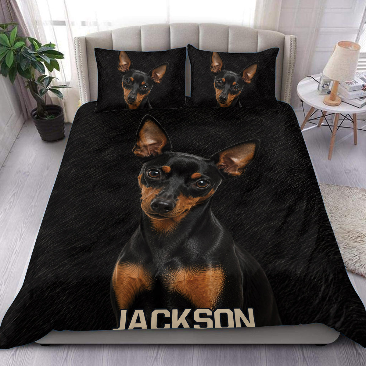 Black and tan Miniature Pinscher duvet cover set styled on a modern bedroom bed