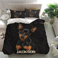 Black Miniature Pinscher duvet cover and matching pillowcases displayed in a bright modern bedroom
