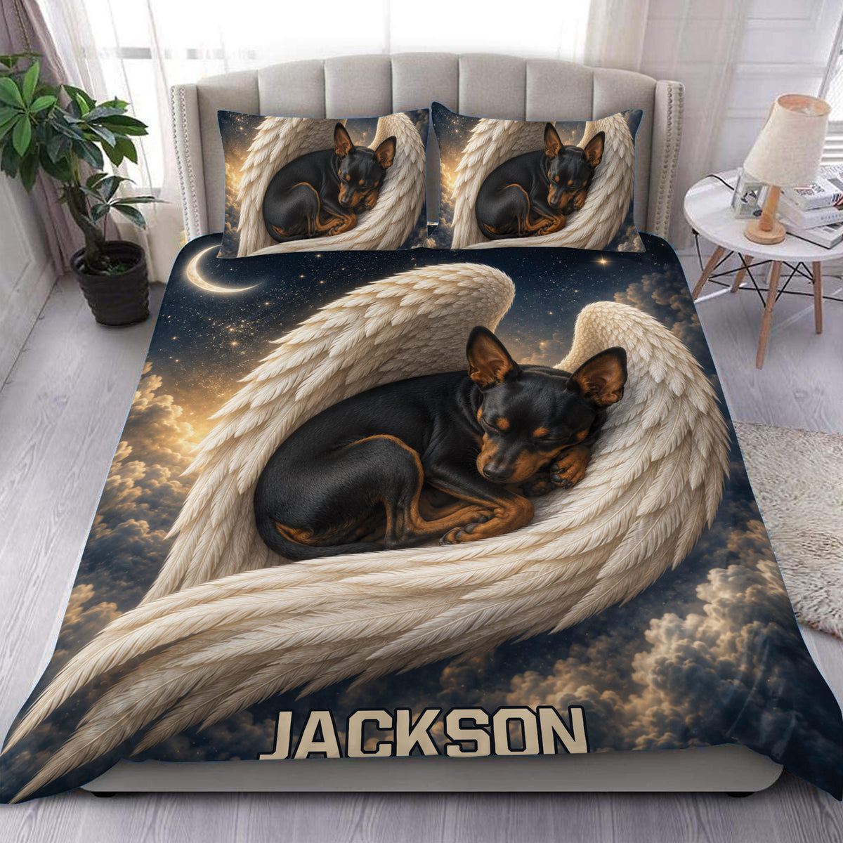 Miniature Pinscher duvet cover set displayed on a bed with angel wings, stars, clouds, and moon artwork