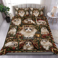 Ragdoll cat duvet cover set displayed on a bed with Christmas gifts, lanterns, greenery, and festive colors