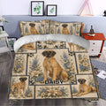 Great Dane bedding styled in a bedroom with large dog portraits, cream flowers, and blue geometric borders