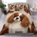 Cavalier King Charles duvet cover set styled on a bed with matching dog portrait pillowcases