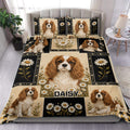 Cavalier King Charles duvet cover set displayed on a bed with daisy panels and black floral accents