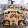 Cavalier King Charles duvet cover set styled in a bedroom with framed dog portraits and warm decor