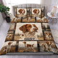 Brittany Spaniel duvet cover set displayed on a bed with rustic plaid framing and scenic dog artwork