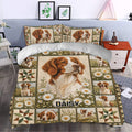Brittany Spaniel duvet cover styled in a bright bedroom with daisies and rustic patchwork artwork