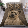 Cairn Terrier duvet cover set displayed on a bed with realistic brown terrier portraits