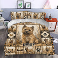 Cairn Terrier duvet cover styled in a bedroom with warm neutral tones, paw prints, plaid panels, and botanical details