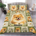 Pomeranian duvet cover set displayed on a bed with green floral panels, daisies, and cheerful dog portraits