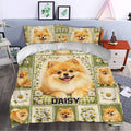 Pomeranian duvet cover styled in a bedroom with a large dog portrait, white daisies, and green gingham details
