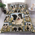 Border Collie duvet cover set displayed on a bed with blue floral borders and multiple dog portraits