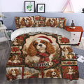 Cavalier King Charles Christmas duvet cover styled in a bedroom with dogs, poinsettias and plaid accents