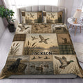 Custom duck hunting duvet cover set displayed on a bed with mallards, marshland, cattails, and rustic panels