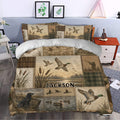 Duck hunting duvet cover styled in a bedroom with mallards, marsh scenery, cattails, and woodland artwork