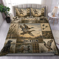 Duck hunting duvet cover set displayed on a bed with mallards, marshland scenes, reeds, and camouflage panels