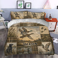 Duck hunting bedding set styled in a bedroom with flying mallards, marsh scenes, reeds, and rustic outdoor artwork