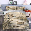 Rustic duck hunting bedroom decor featuring a mallard duvet cover set with reeds and wetland scenery