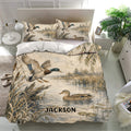 Duck hunting bedding displayed in a bright bedroom with mallard ducks, cattails, water, and natural tones
