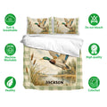 Duck hunting bedding set displayed with mallard artwork, marsh scenery, breathable fabric, and care feature icons