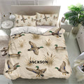 Duck hunting bedding set displayed in a bright bedroom with mallards, water, and cattails