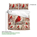 Cardinal duvet cover set showing the printable side with red birds, berries, branches, and winter scenery