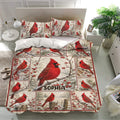 Winter cardinal bedding set styled in a bright bedroom with matching bird-patterned pillowcases