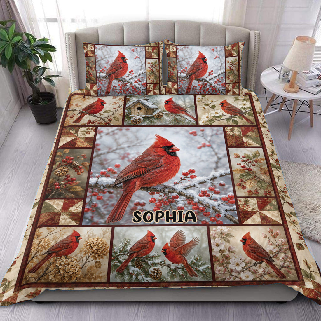 Cardinal duvet cover set displayed on a bed with red birds, snowy branches, berries, and patchwork borders