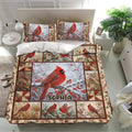Cardinal bedding set in a bright bedroom featuring red bird artwork, berry branches, and coordinated pillowcases