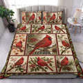 Cardinal duvet cover set displayed on a bed with red birds, berries, pinecones, and botanical panels