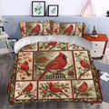 Cardinal duvet cover styled in a bedroom with red birds, holly, berries, and seasonal botanical artwork