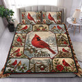 Cardinal duvet cover bedding set displayed on a bed with red birds, snowy evergreens, birdhouses, and festive winter details.