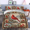Cardinal duvet cover styled in a bedroom with red birds, snowy scenery, birdhouses, holly, and rustic Christmas decor.