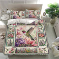 Floral hummingbird duvet cover set displayed on a bright bedroom bed with matching pillowcases