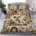 Hummingbird duvet cover set displayed on a bed with festive greenery, poinsettias, lanterns, and berries